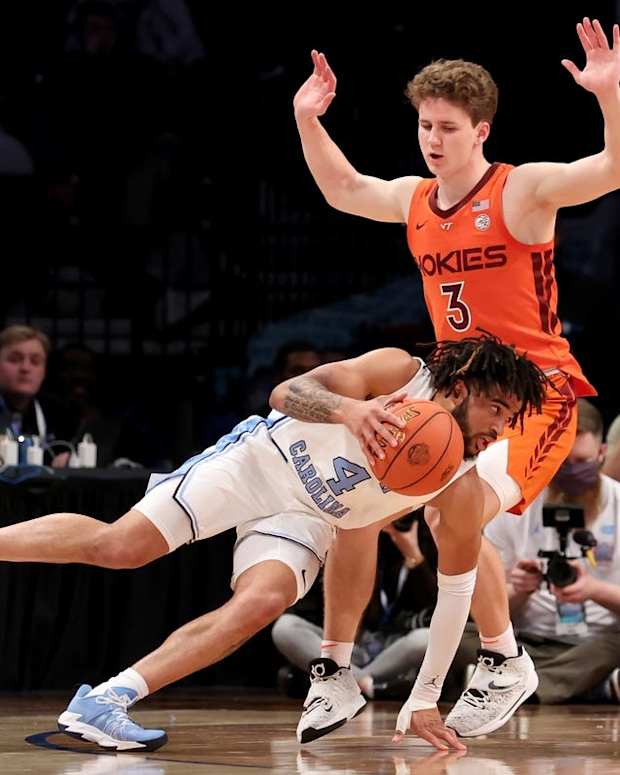 Mar 11, 2022; Brooklyn, NY, USA; North Carolina Tar Heels guard R.J. Davis (4) drives around Virginia Tech Hokies guard Sean Pedulla (3) during the second half of an ACC Tournament semifinal game at Barclays Center. Mandatory Credit: Brad Penner-USA TODAY Sports
